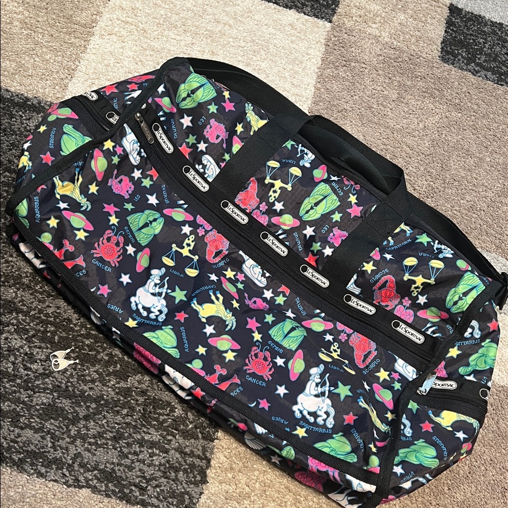 LeSportsac weekender duffle bag, zodiac signs, black EUC! Keys included!